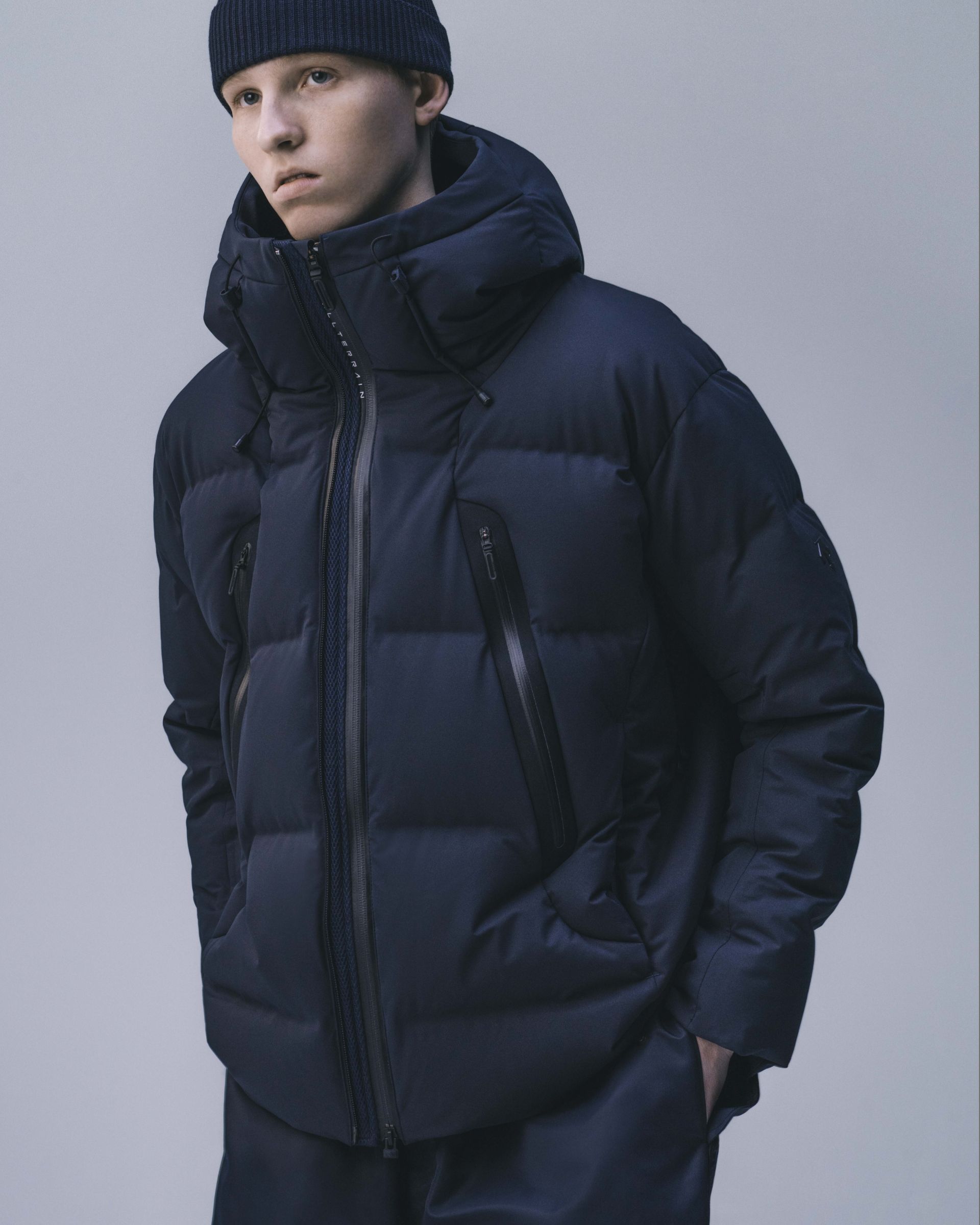 Down jacket with heat welded seams